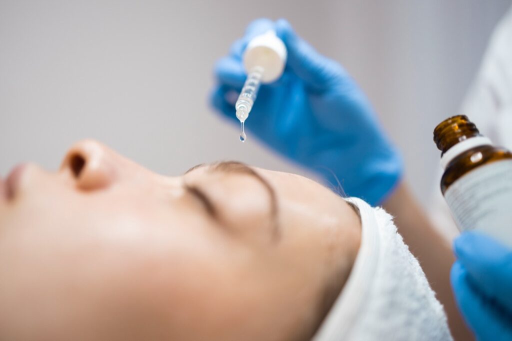 Application of serum to the face | Fargo facials and chemical peels