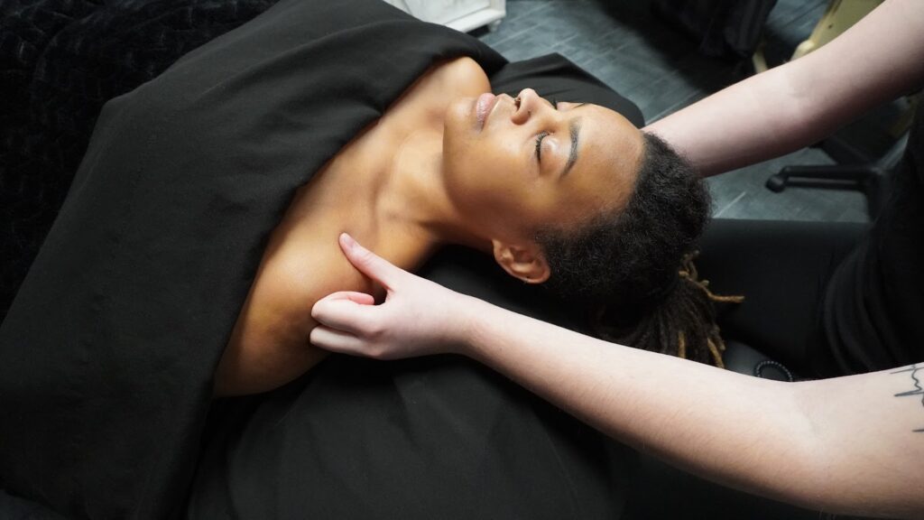 Close-up of a customer receiving a therapeutic massage at Uptown Haven
