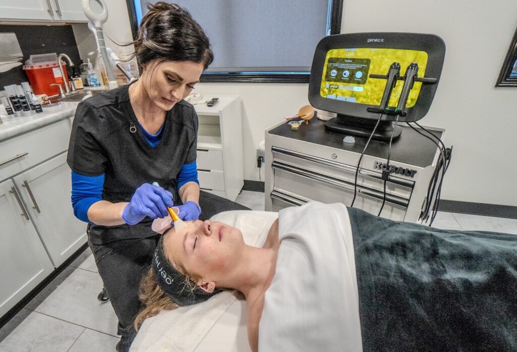 Customer enjoying a relaxing facial treatment at Uptown Haven, a perfect service to consider with wellness gift cards.