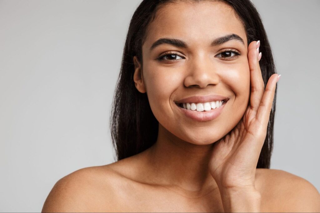 A woman's face glowing after microdermabrasion treatment