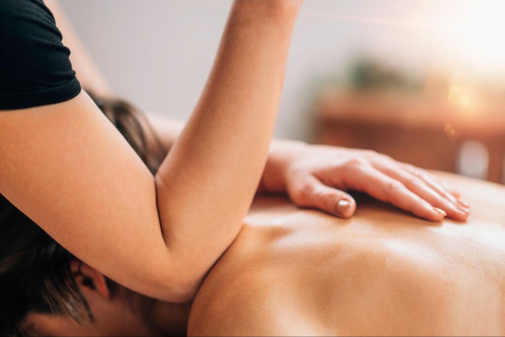 Deep tissue massage therapy complementing a massage and chiropractic adjustment routine for pain relief.