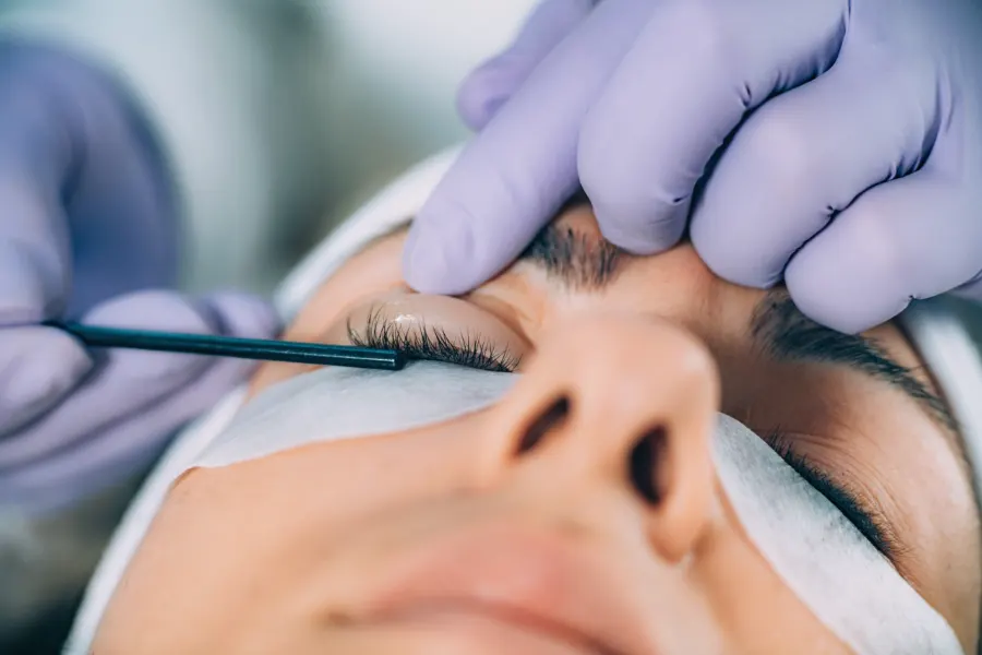 Lash lift treatment being applied to a client